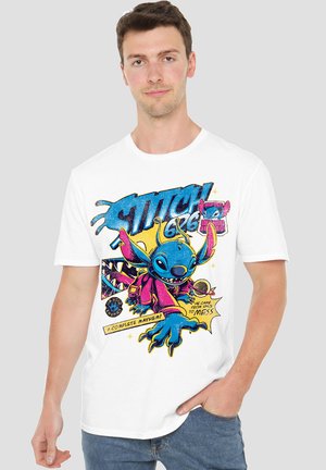 Short-sleeve white t-shirt featuring a colorful graphic of Stitch, with bold text and comic-style elements, highlighting playful design details.