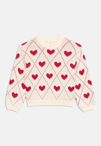 Megztinis megztas iš kremo spalvos pagrindo, puoštas raudonųjų širdelių rombo raštu. Apvalus kaklas, ilgos rankovės, ribuotos rankogaliai ir apačia.