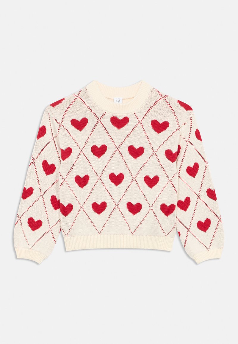 Megztinis megztas iš kremo spalvos pagrindo, puoštas raudonųjų širdelių rombo raštu. Apvalus kaklas, ilgos rankovės, ribuotos rankogaliai ir apačia.