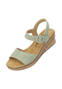 Sandalo con zeppa in suede verde, dotato di una larga fascia anteriore e una cintura alla caviglia regolabile, con una suola leggera e testurizzata.