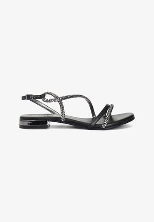 Sandalini neri con tacco piatto, realizzati in pelle liscia. Presentano cinturini incrociati decorati con piccole perline metalliche per un tocco di dettaglio.