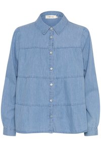 Ljusblå denimskjorta med knappstängning fram, krage och långa ärmar. Har horisontella sömmar och en subtil textur.