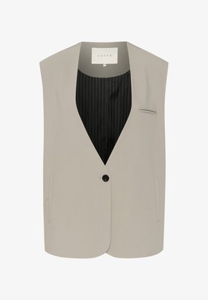 Lys beige ærmeløs vest lavet af glat stof. Har en enkelt sort knap, to sidelommer og en stribet sort foret.