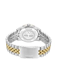Orologio in acciaio inossidabile con bracciale intrecciato in argento e oro. Presenta una corona, una cassa resistente all'acqua e il logo del marchio inciso sul retro.