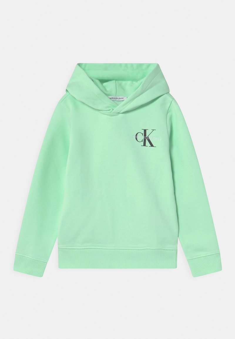 Miętowa bluza z kapturem wykonana z miękkiej mieszanki bawełny, z ciemnoszarym logo z przodu, ściągaczami przy rękawach oraz luźnym krojem.