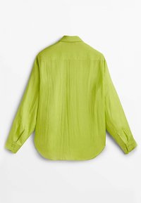 Green long-sleeve shirt made from lightweight fabric, featuring a loose fit, collar, and buttoned cuffs with a textured finish.