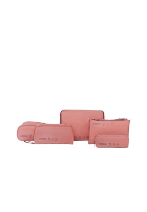 Set of five pink travel organizer bags in varying sizes, each with small icons indicating suggested contents.