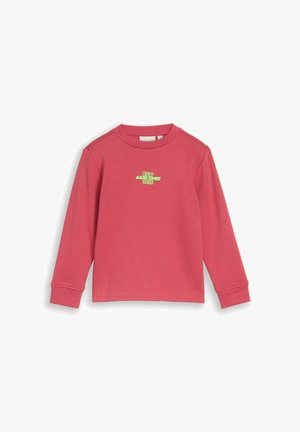 Roze kindervest met lange mouwen, geribde boorden en kleine groene tekst op de borst met de tekst "Only good vibes here".