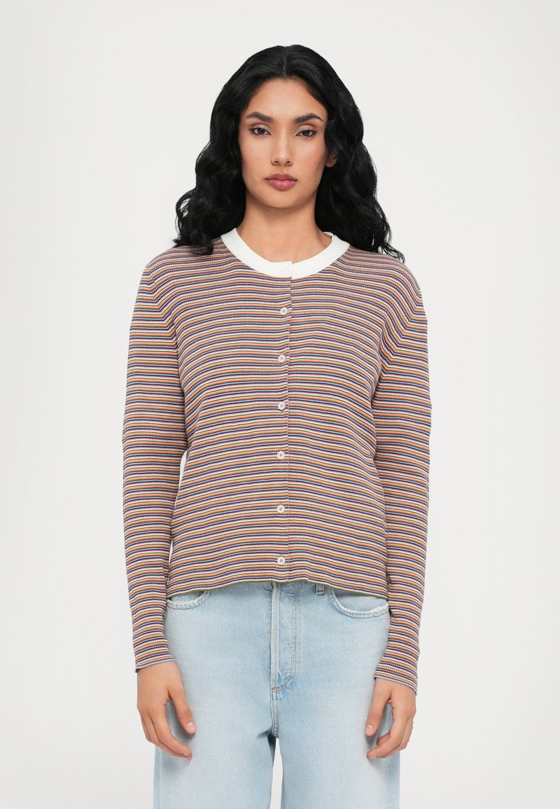 Striped cardigan featuring multicolored horizontal lines, white collar, and front button closure. Soft texture and fitted design.