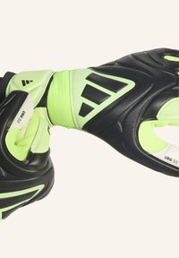 Doelmannenhandschoenen met een zwarte latex palm, lichtgroene accenten, textiele polsband en ergonomisch vingerontwerp voor grip en flexibiliteit.
