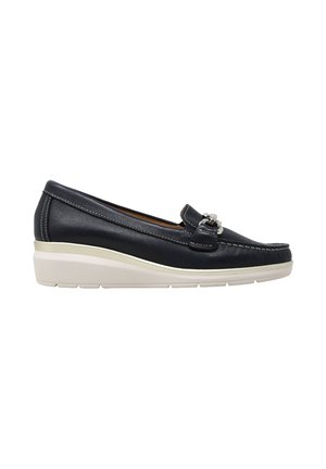 Mocassino slip-on in pelle nera con suola platform bianca e dettaglio fibbia argento sulla parte superiore, visto di lato su sfondo bianco.