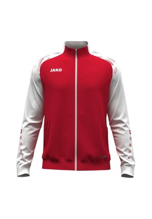 Rood-witte sportjas met rits en hoge kraag, met het merk JAKO op de borst, patroon op de schouders en zakken aan de voorkant.