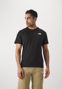 The North Face M SS BOX NSE TEE - T-shirts med print - black/optic emerald