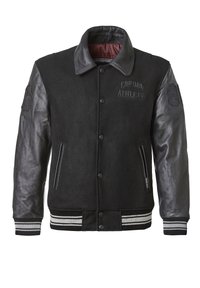 Black varsity jacket with wool body and leather sleeves. Ribbed collar and cuffs with contrasting white stripes; features embroidered logo and snap buttons.
