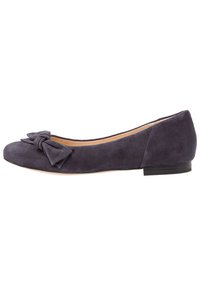 Dark purple suede flat shoe with rounded toe and decorative fabric bow on front, featuring low black heel and beige interior lining.