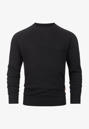 Black knitted sweater featuring a crew neckline, ribbed cuffs and hem, with a smooth texture and a subtle logo patch at the lower side.