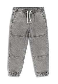 Szare dresy wykonane z miękkiego materiału, z elastycznym pasem w talii i sznureczkami do regulacji, bocznymi kieszeniami oraz elastycznymi mankietami przy kostkach.