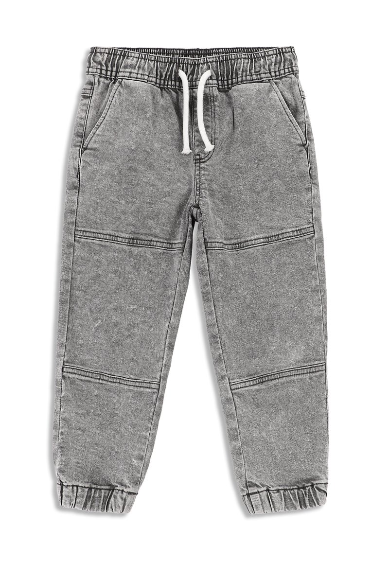 Szare dresy wykonane z miękkiego materiału, z elastycznym pasem w talii i sznureczkami do regulacji, bocznymi kieszeniami oraz elastycznymi mankietami przy kostkach.