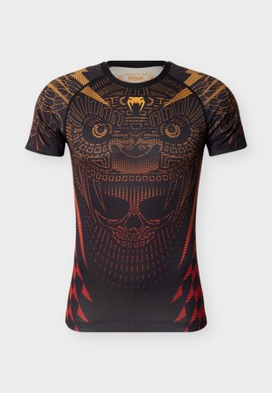 Black and orange athletic shirt with intricate skull and tribal patterns, short sleeves, and a fitted design. Features a round neckline.