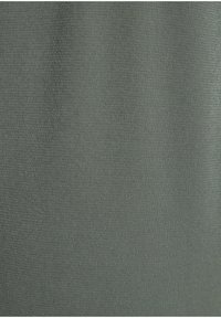 Dark green fabric shows a smooth, textured surface with a subtle weave pattern, suitable for clothing or upholstery applications.