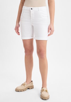 White denim shorts with rolled cuffs, featuring a button and zip closure, front pockets, and a fitted design. Paired with beige shoes.