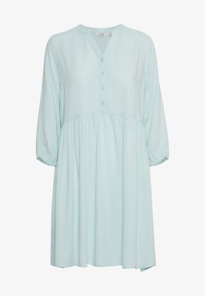 Vestido verde menta claro con escote en V, parte delantera con botones y cintura fruncida. Mangas largas con puños elásticos, tejido suave. Diseño casual.