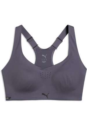 Sujetador deportivo gris con tirantes ajustables estilo racerback y agujeros de ventilación perforados en el centro delantero, con logotipo de Puma debajo del busto.