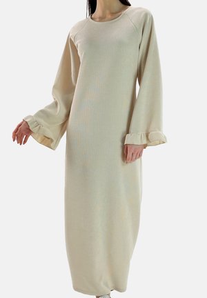 Lang, lysebeige kjole lavet af tekstureret stof med rund hals, løse ærmer og opsmøgede manchetter. Gulvlængde design med en afslappet pasform.