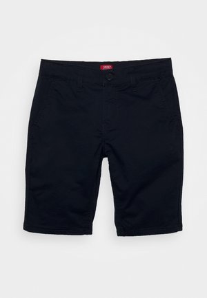 Pantalones cortos casuales negros con cierre de botones, trabillas para cinturón y bolsillos delanteros, extendidos sobre un fondo claro.