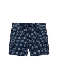 Pantaloni scurți de înot navy cu un model de buline albe, talie elastică și șnur ajustabil. Material ușor, design de lungime medie până la coapsă.