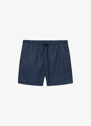 Marine zwembroek met een wit stippenpatroon, elastische tailleband en verstelbaar trekkoord. Lichtgewicht stof, ontwerp tot halverwege de dij.