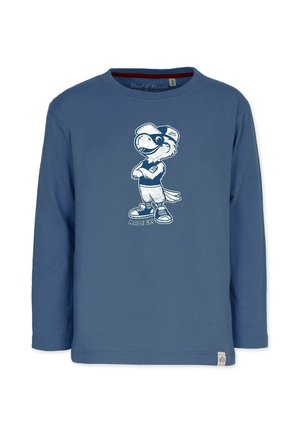 Blå langærmet skjorte med en tegneserie-fuglemaskot med kasket og sneakers, der krydser armene, teksten "MADE IT!" under figuren.