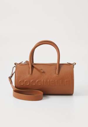 Tan leather handbag with a textured surface, rounded top handles, and a detachable shoulder strap. Features embossed branding.