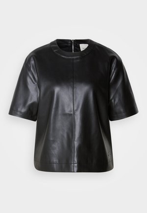 Svart läder topp med korta ärmar, rund halsringning och blixtlås bak. Har en jämn textur och en avslappnad passform.