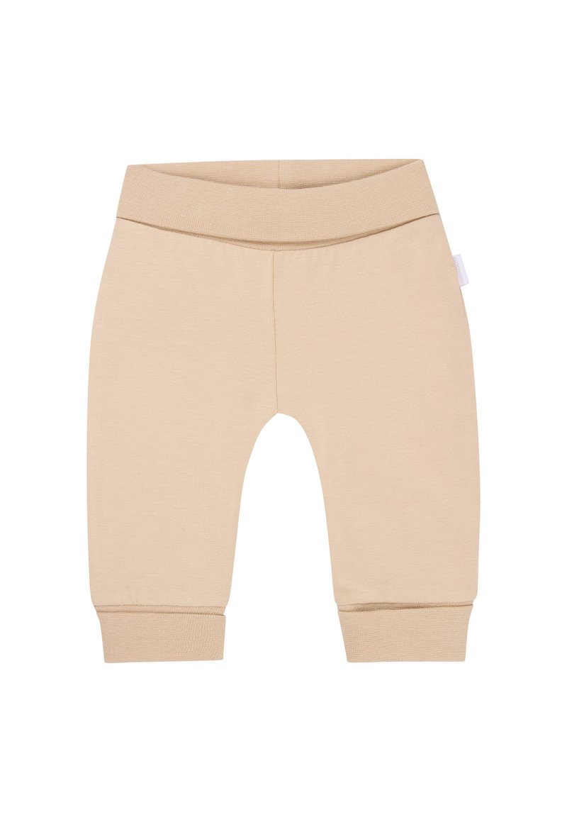 Beige katoenen leggings met een elastische tailleband, taps toelopende benen en ribbelboorden. Glad textuur en eenvoudig ontwerp zonder patronen of accenten.