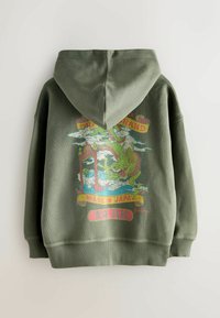 Felpa con cappuccio verde oliva. Presenta un design colorato di un drago e il testo "Made in Japan" sul retro. Materiale in cotone con polsini a costine.