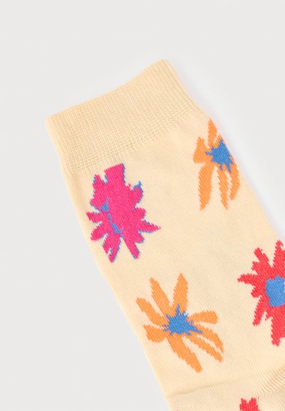 Κρέμ κάλτσα με αφηρημένα λουλούδια σε ζωηρό ροζ, πορτοκαλί και κόκκινο χρώμα, με μπλε κέντρα.