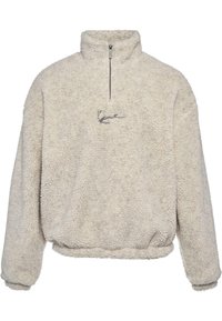 Cremefarbener Fleece-Pullover mit hohem Kragen und Viertel-Reißverschluss. Verfügt über eine weiche, strukturierte Oberfläche und ein gesticktes Logo auf der Brust.