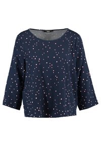 Top blu navy con maniche a tre quarti, caratterizzato da un motivo a rombi rosa sparsi e scollatura rotonda. Tessuto leggero.