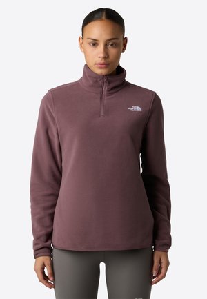 Fleece pullover in mauve, met een kraag met halve rits, lange mouwen en een logo-accent op de borst. Soepele textuur, ontspannen pasvorm.