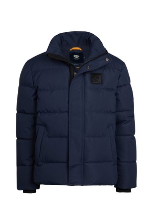 Veste matelassée bleu marine avec un design quilté, dotée d'un col haut, d'une fermeture éclair et de poches latérales. Tissu texturé avec un écusson logo.