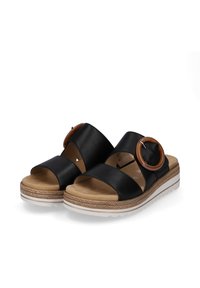 Black leather sandals with two wide straps, decorative round buckle, and a textured platform sole. Features a cushioned footbed for comfort.