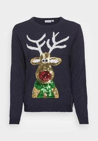 Granatowy sweter z festywnym wzorem renifera w złotych, czerwonych i zielonych cekinach, z białymi rogami i okrągłym dekoltem.