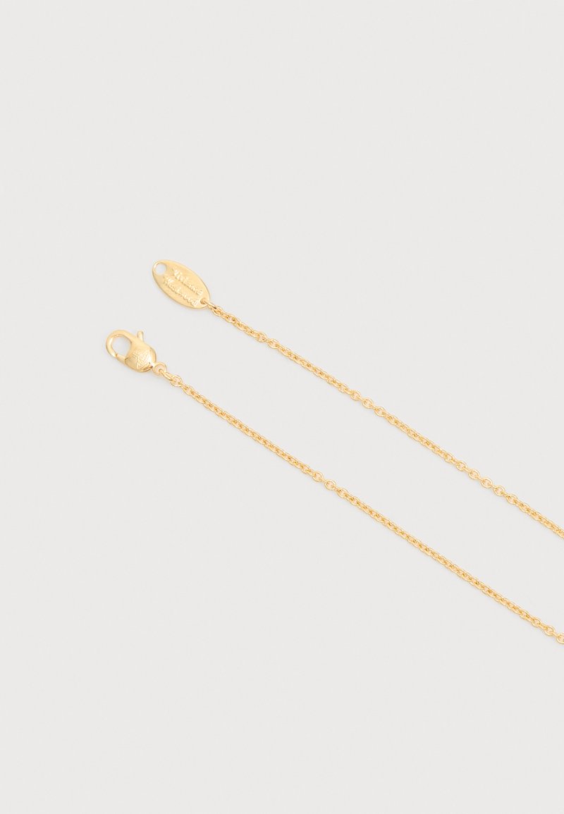 Gold-toned thin chain necklace with a lobster clasp on one end and an oval tag on the other, set against a plain light background.