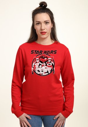 Rød sweatshirt med grafisk print med "STAR WARS" tekst og figurer, lavet af blødt stof med lange ærmer og rund halsudskæring.