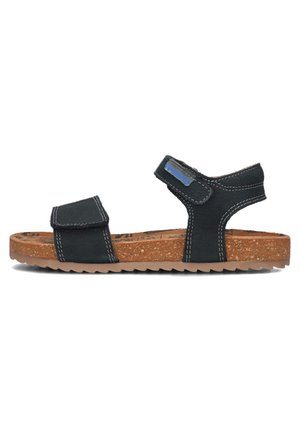 Zwarte stoffen sandaal met verstelbare banden, kurken zool en een gestructureerde rubberen onderkant. Witte stiksels accentueren de banden en zijkanten.