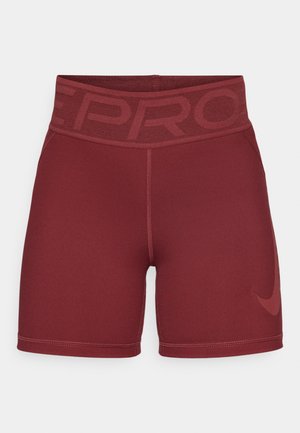 Shorts de sport bordeaux avec une large ceinture élastique arborant un motif en relief subtil et un petit logo Nike sur le côté inférieur.