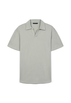 Polo shirt verde chiaro a maniche corte con colletto, caratterizzato da una texture sottile e una vestibilità rilassata. Nessun motivo o accentuazione visibile.