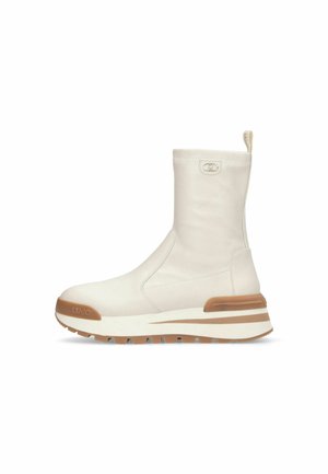 White ankle boot with a smooth texture, a rounded toe, and a contrasting tan rubber sole. Features a pull tab and subtle logo detail.