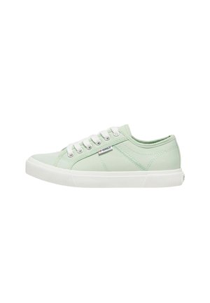 Low-top light green canvas sneaker with white laces, rubber sole, and small "Only" fabric label on the side.